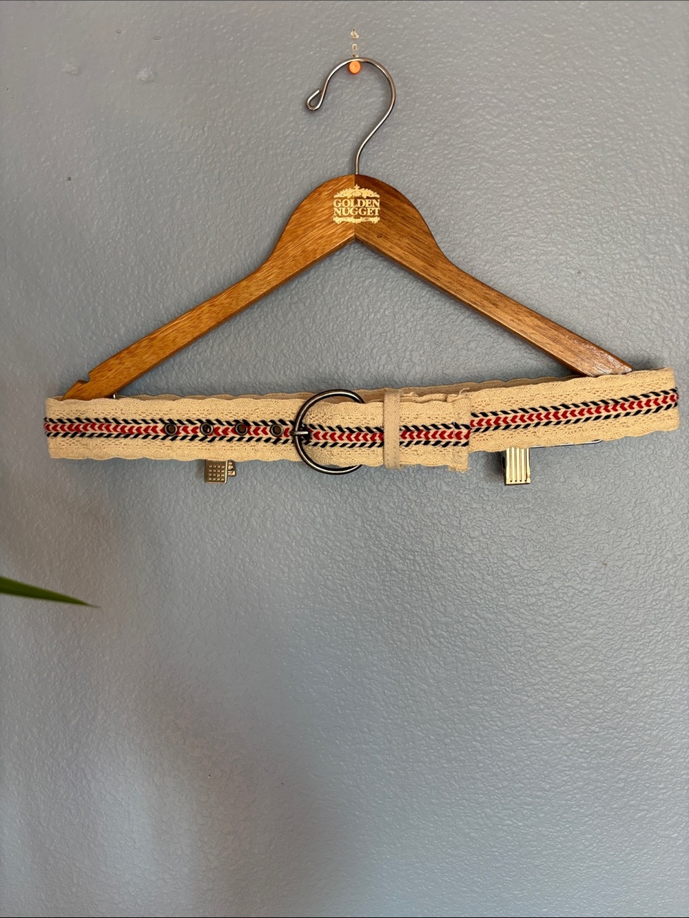 Canvas cream color crochet belt with red and blue embroidered accents. Size 7